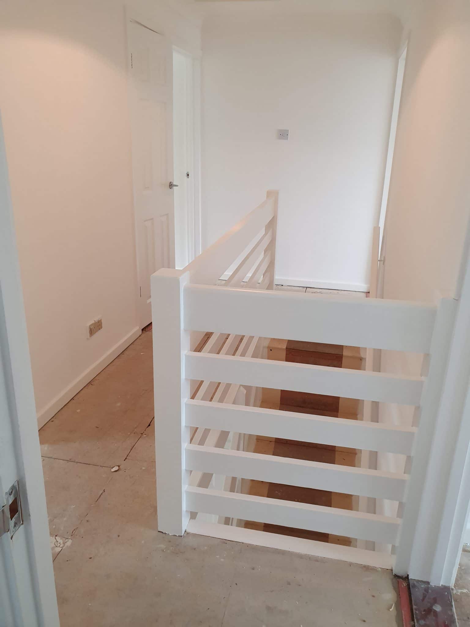 Landing with a white painted horizontal balustrade