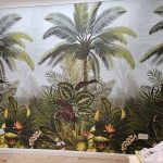 Wall papered in a tropical palm tree mural